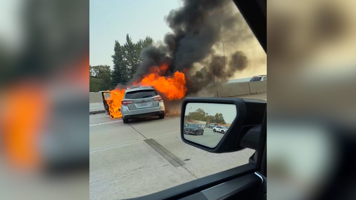 Army Ranger rescues fellow soldier trapped in car as it becomes engulfed in flames: Watch