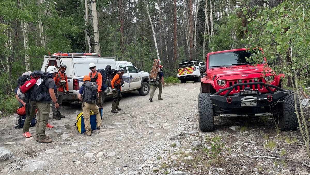 A Colorado hiker is rescued after being left behind by coworkers on a Colorado mountainside