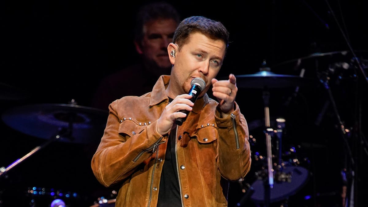 ‘Is she OK?’: Scotty McCreery stops show after seeing man hit woman in crowd