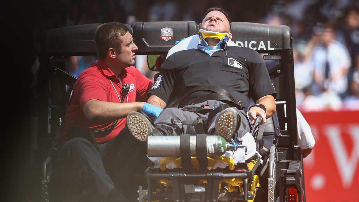 Umpire Nick Mahrley carted off after broken bat hits his neck during Yankees-Rockies game