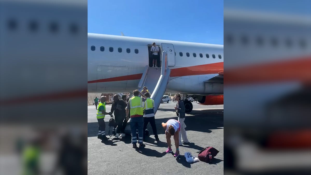 Video shows easyJet passengers evacuate plane as smoke from vape explosion fills cabin