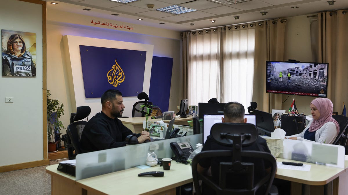 Israeli forces raid, order closure of Al Jazeera bureau in West Bank