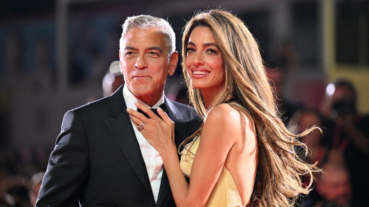 George and Amal Clooney walk red carpet with Brad Pitt and Ines de Ramon