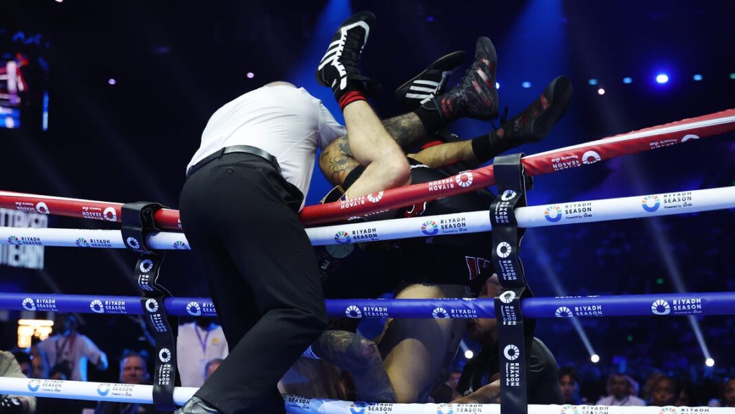 Ben Whittaker, Liam Cameron tumble over ropes during light heavyweight fight