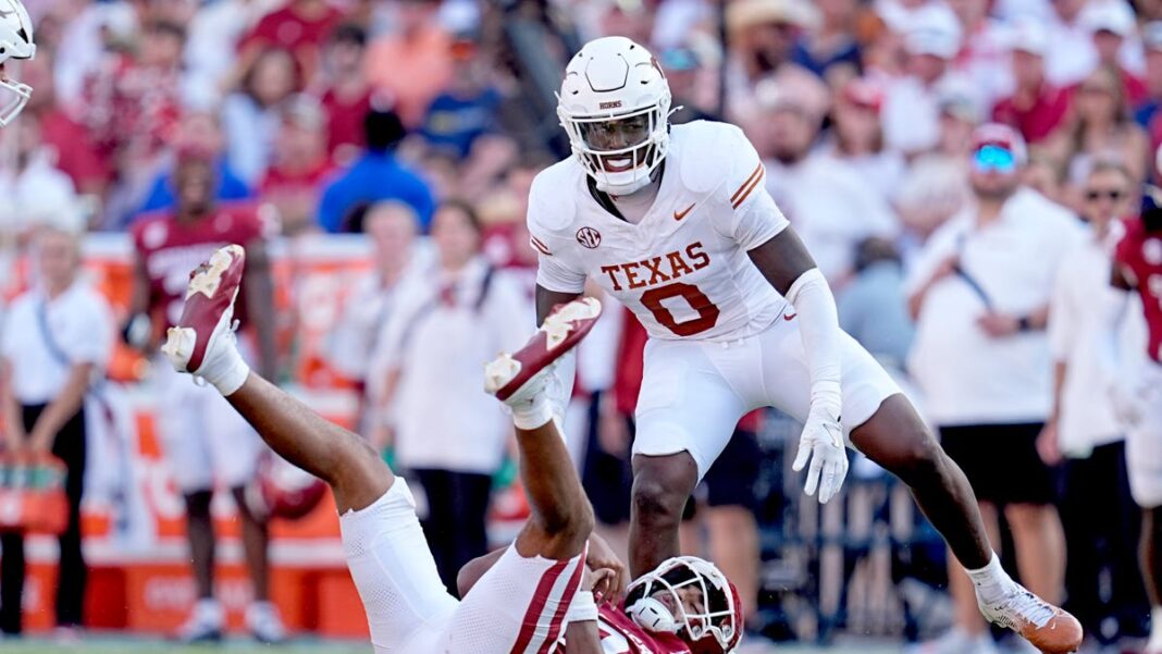 Texas football plants flag through Baker Mayfield Oklahoma jersey after Red River Rivalry