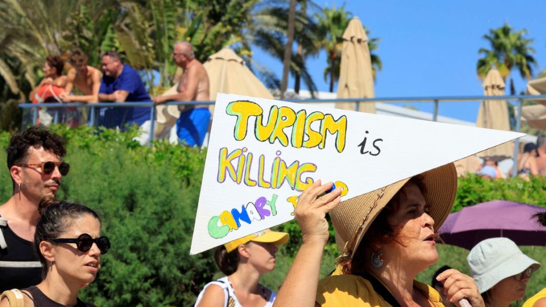 ‘This beach is ours’: Thousands protest in Spain’s Canary Islands against over tourism