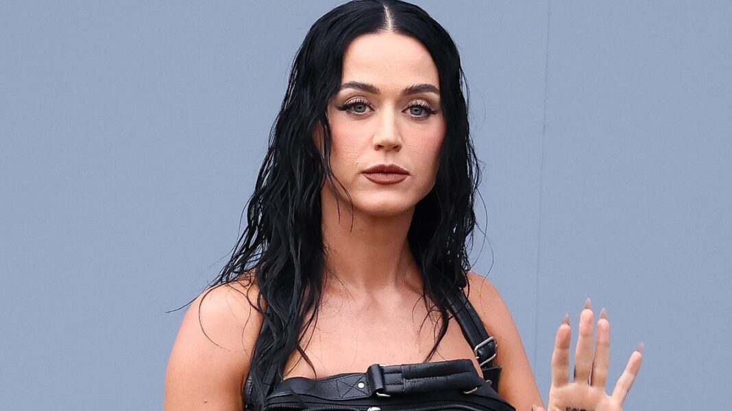 Katy Perry wears zippered bag dress to Balenciaga’s Paris Fashion Week show