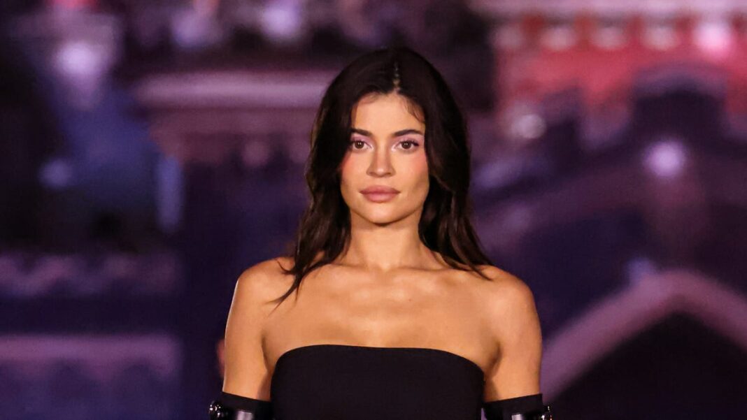 Kylie Jenner walks the runway wearing princess gown in Paris Fashion Week debut