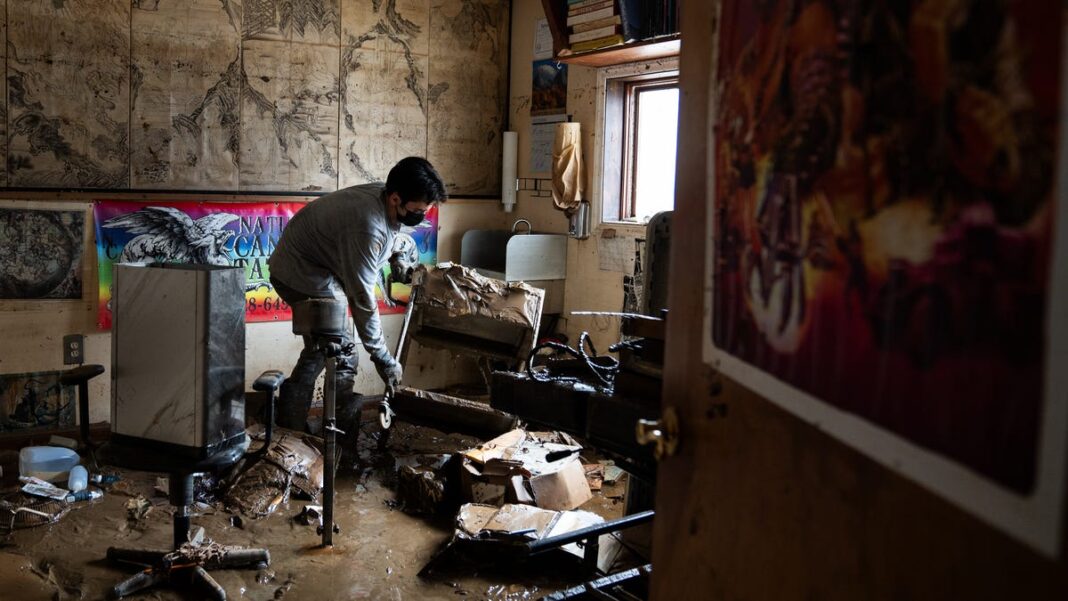 After Helene, a small North Carolina town starts recovery, one shovel of mud at a time