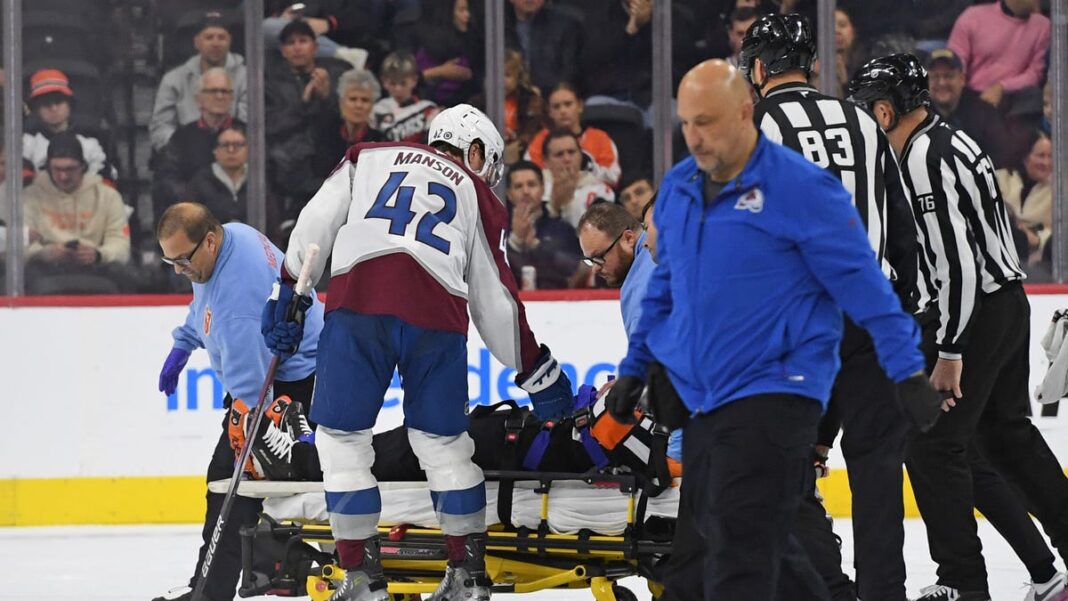 NHL referee Mitch Dunning taken off ice on stretcher after collision