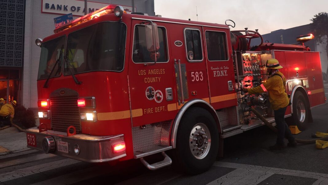 Iconic Hollywood Hills erupts in fire, prompting more evacuation orders in Los Angeles